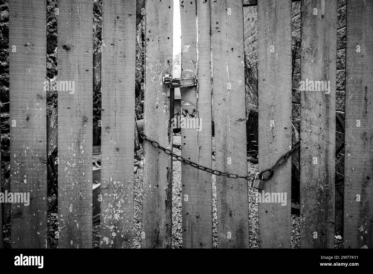 Weathered wooden gate locked with hasp and chain Stock Photo Alamy