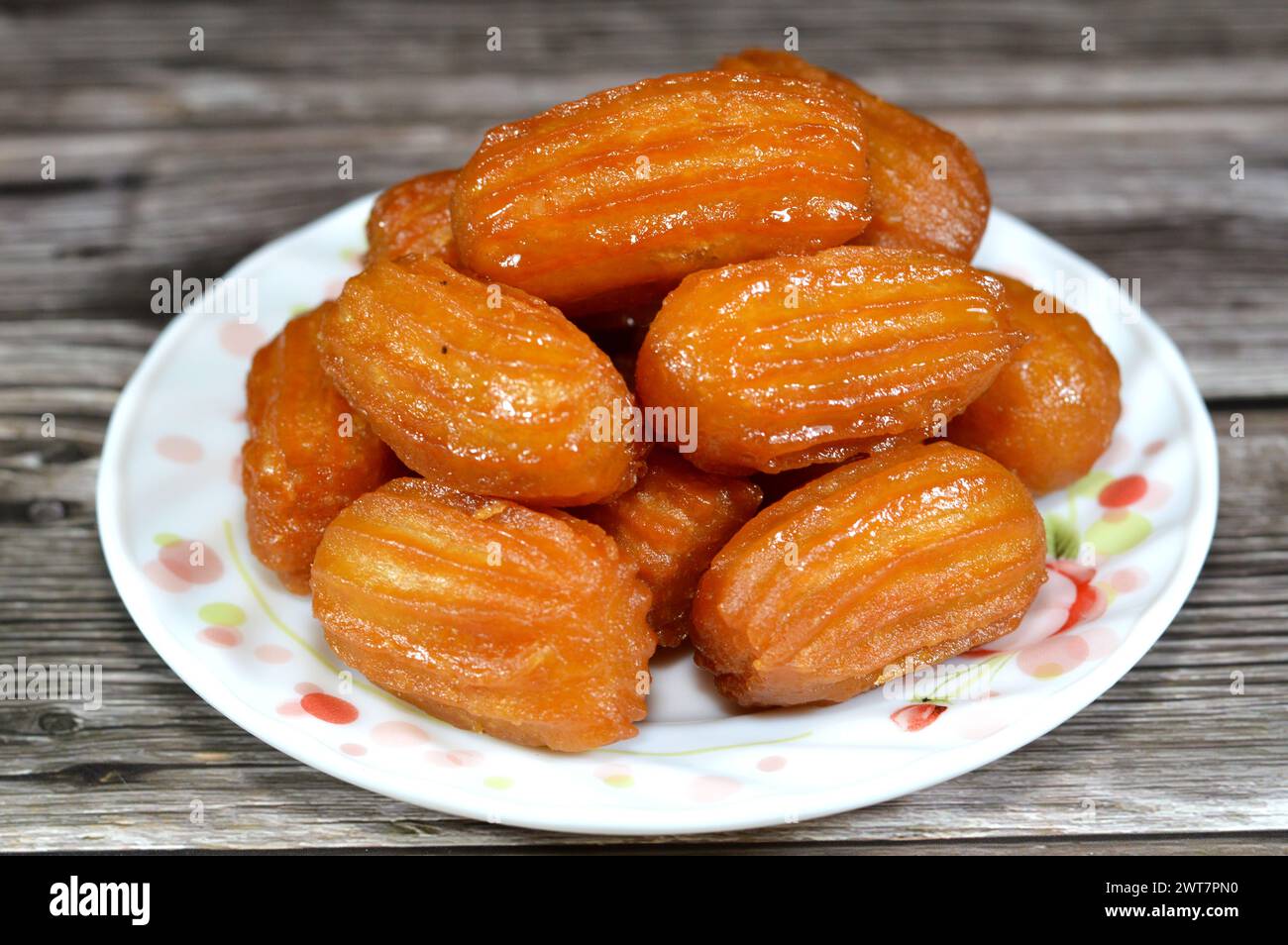 Balah el Sham or Egyptian Choux Pastry, very popular Ramadan month dessert in Egypt and middle east, crispy and tender choux pastry deeply fried and c Stock Photo