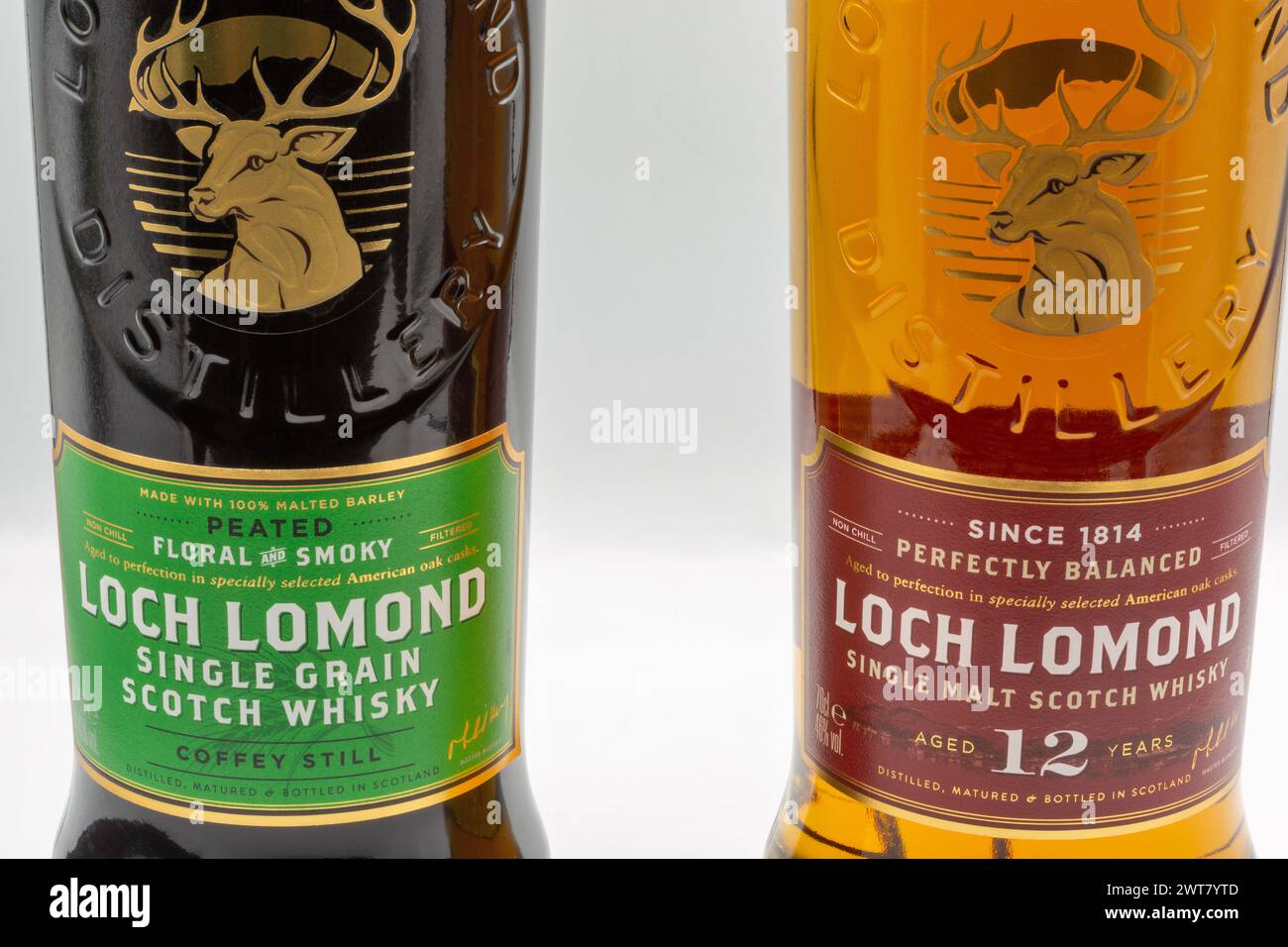 Kyiv, Ukraine - September 06, 2022: Studio shoot of Loch Lomond Single Malt and Single Grain Scotch whisky bottles closeup against white. It is a High Stock Photo