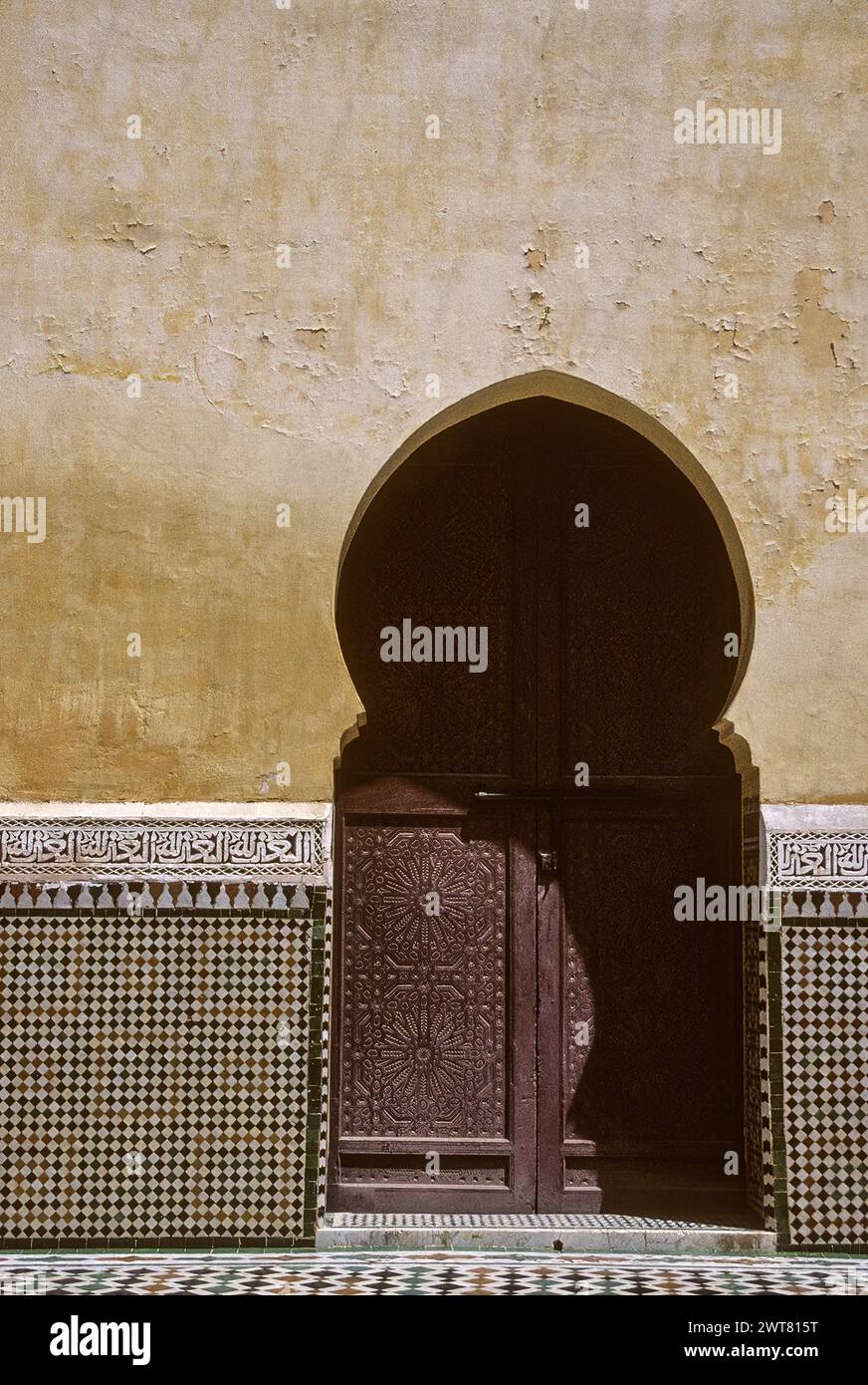 Meknes, Morocco.  Mausoleum of Moulay Ismail.  Horseshoe Arch Doorway. Stock Photo