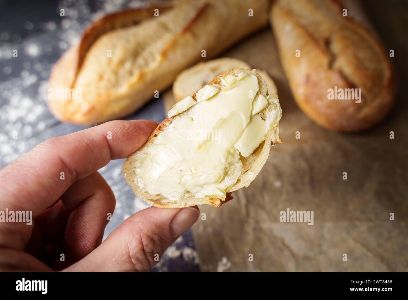 Augsburg, Bavaria, Germany March 16, 2024 Man holding a piece of