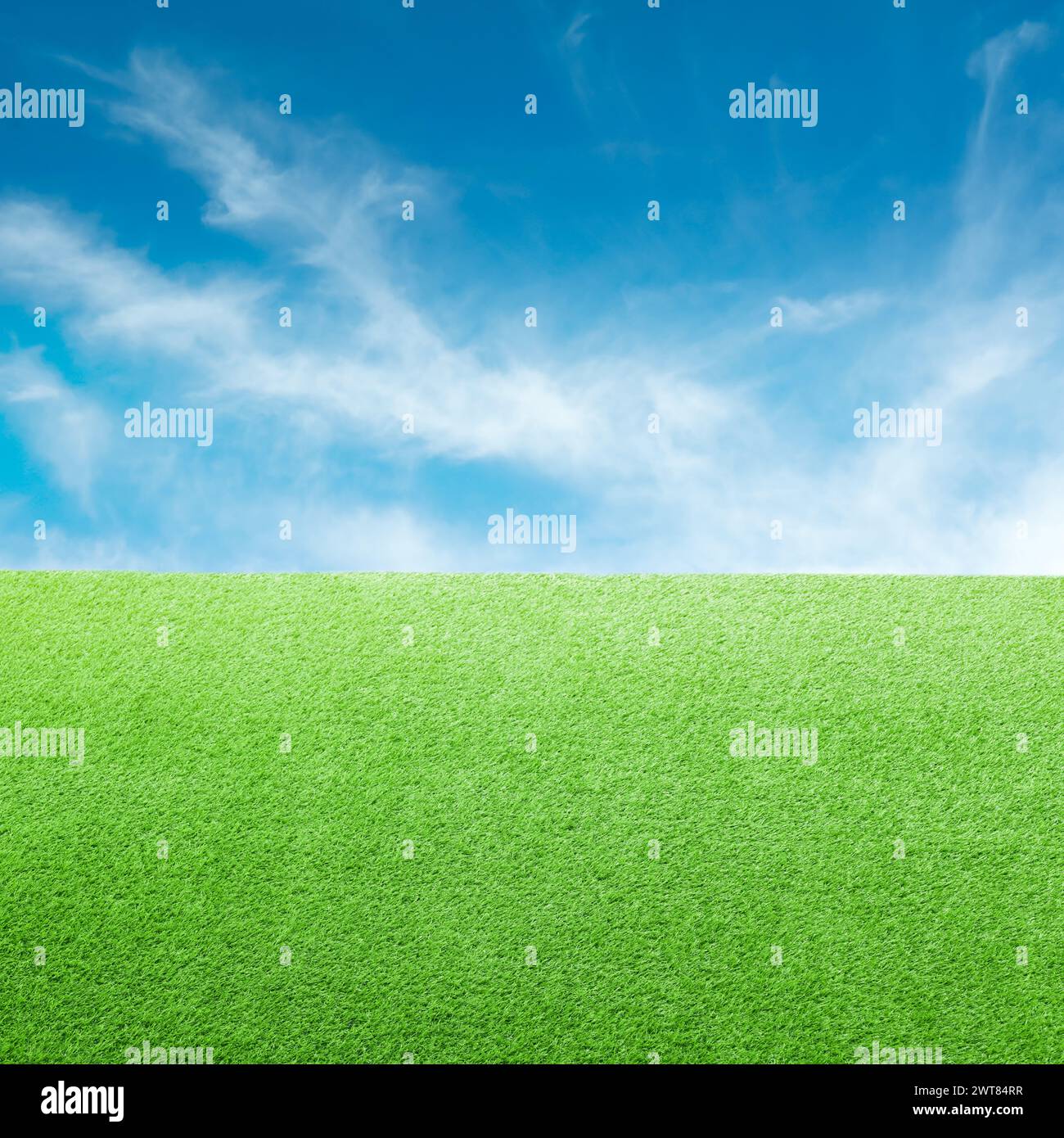 Green grass under blue sky with clouds Stock Photo - Alamy