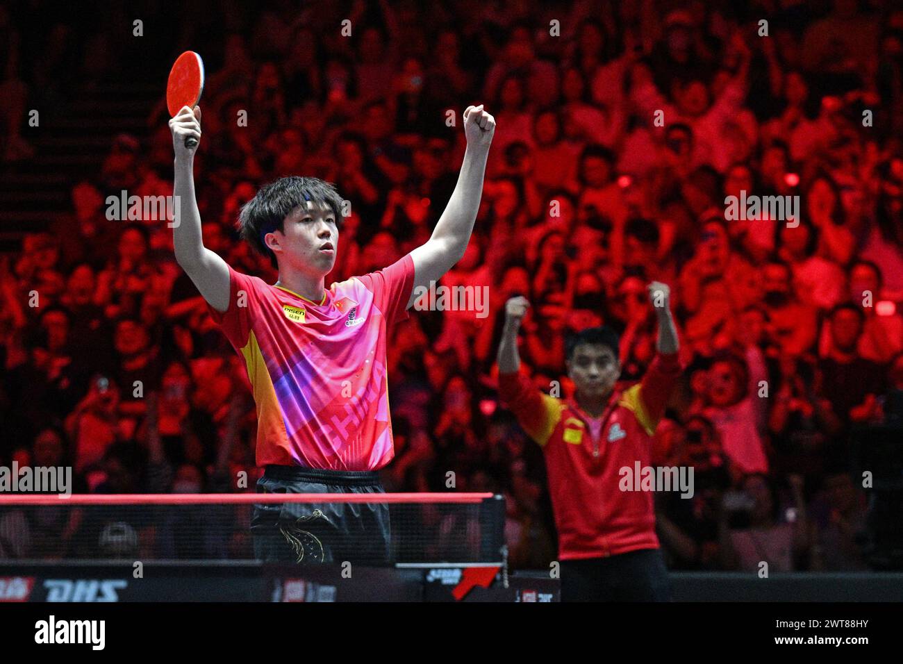 Singapore. 16th Mar, 2025. Wang Chuqin of China celebrates after
