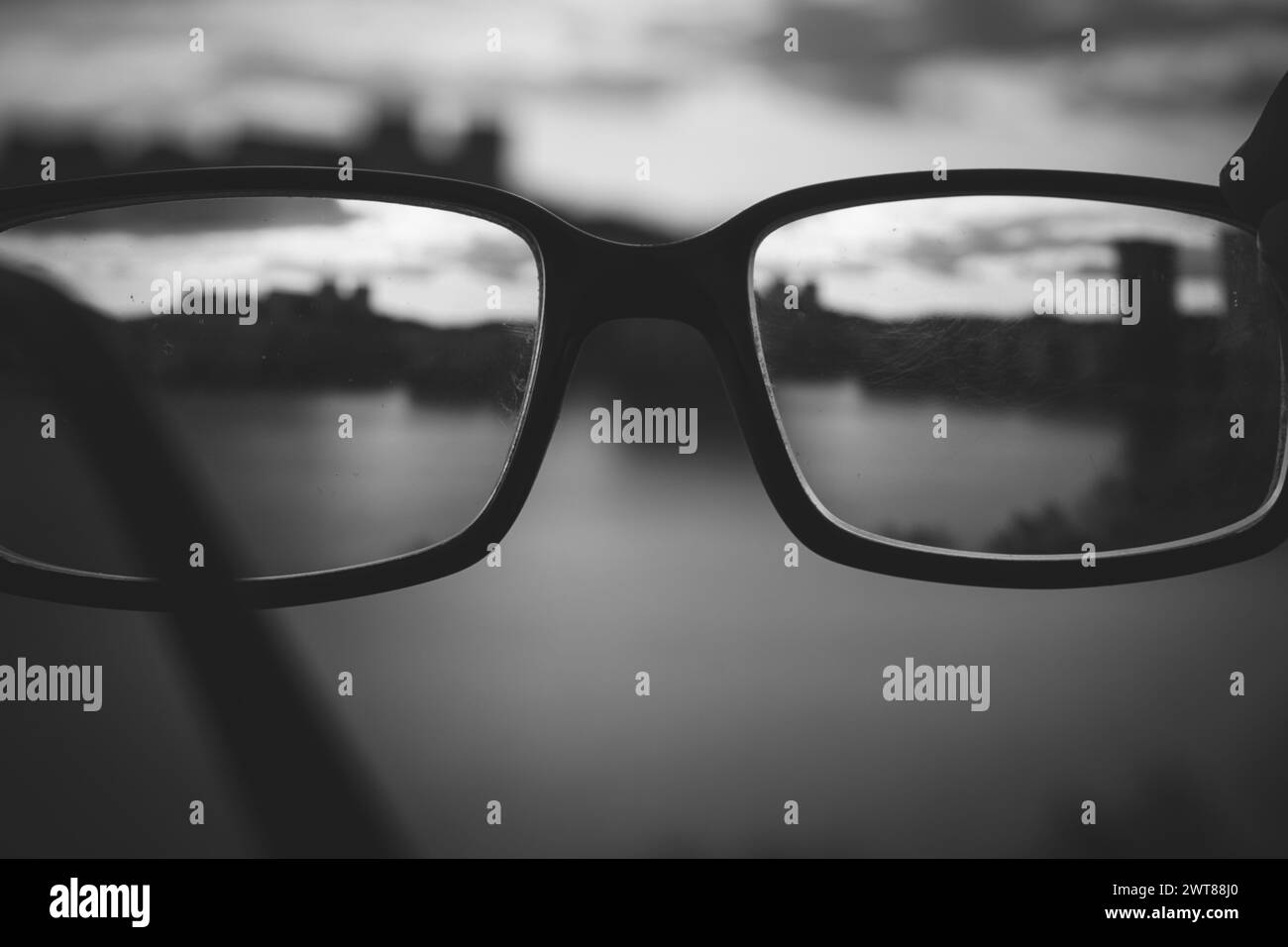 A close up of glasses in black and white Stock Photo