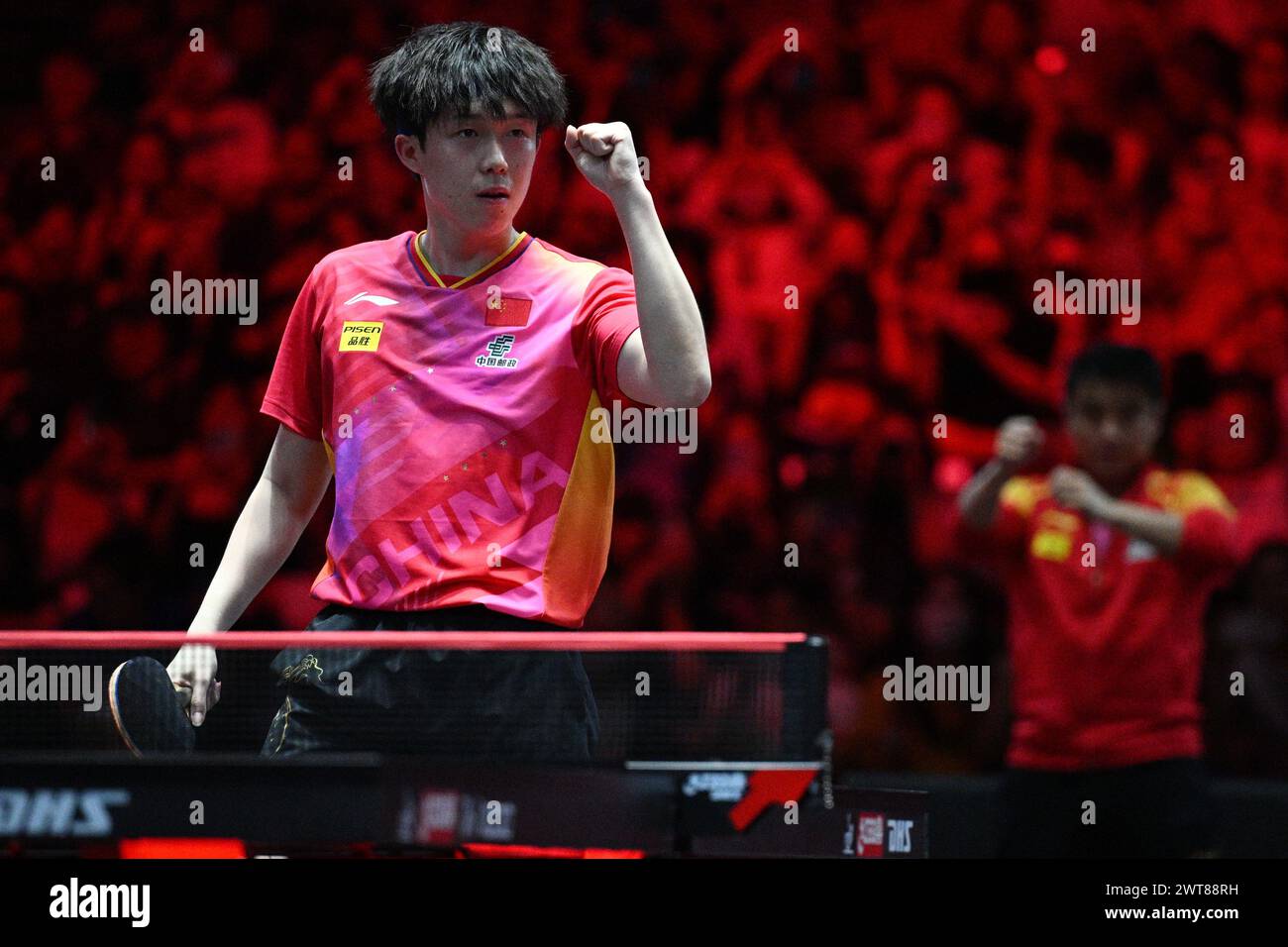 Singapore. 16th Mar, 2024. Wang Chuqin of China celebrates after