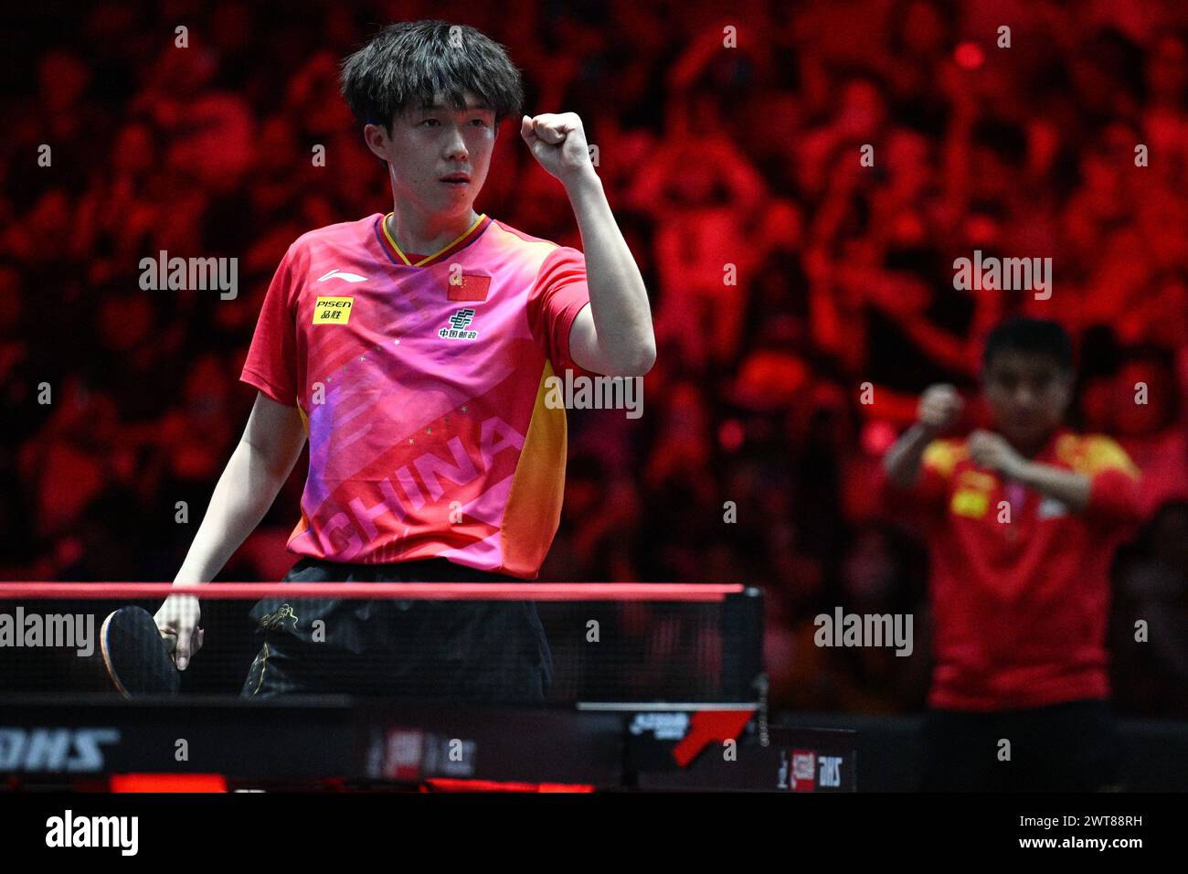 Singapore. 16th Mar, 2025. Wang Chuqin of China celebrates after