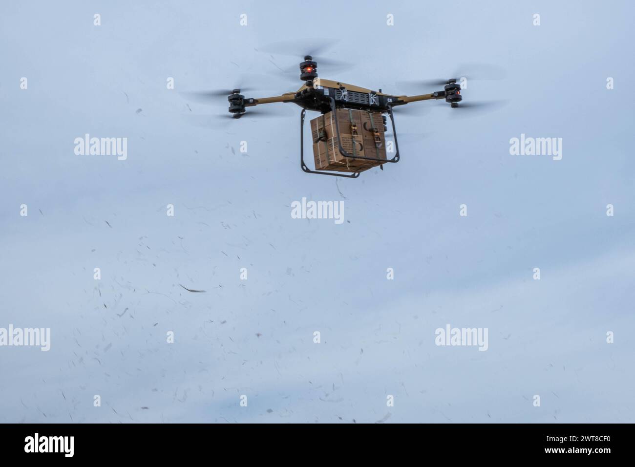 Fort Drum, United States. 03 May, 2024. A cargo of Meals, Ready-to-Eat lifts off using a TRV 150, Tactical Resupply Vehicle, during training with the U.S Army 10th Mountain Division at Fort Drum, March 5, 2024, in Fort Drum, New York. The new electric supply drones can deliver up to 440-pounds of payload during battlefield conditions.  Credit: SFC Neysa Canfield/U.S Army/Alamy Live News Stock Photo