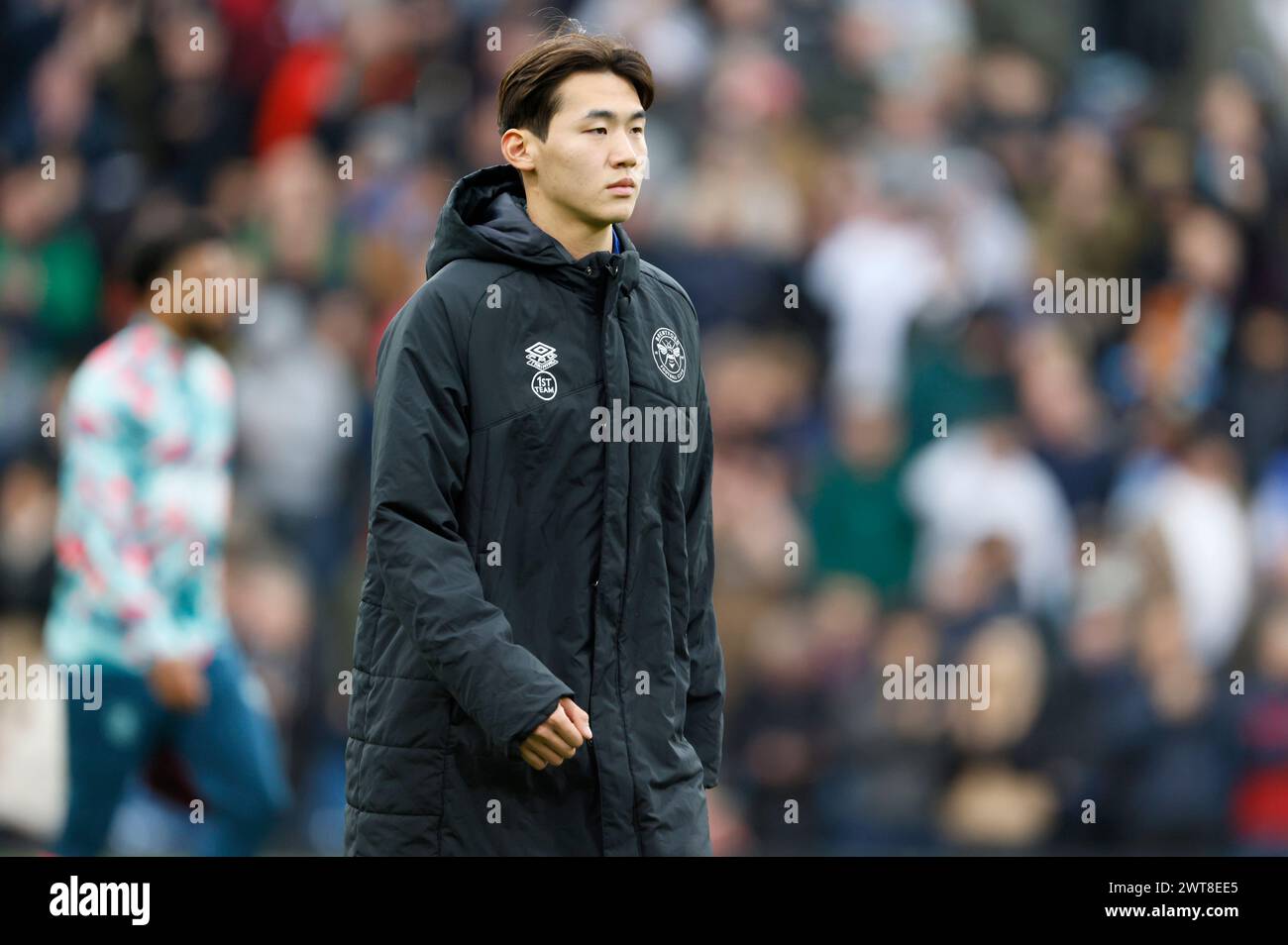 Brentford's Kim Ji-Soo makes his way to the bench before the Premier League match at Turf Moor, Burnley. Picture date: Saturday March 16, 2024. Stock Photo