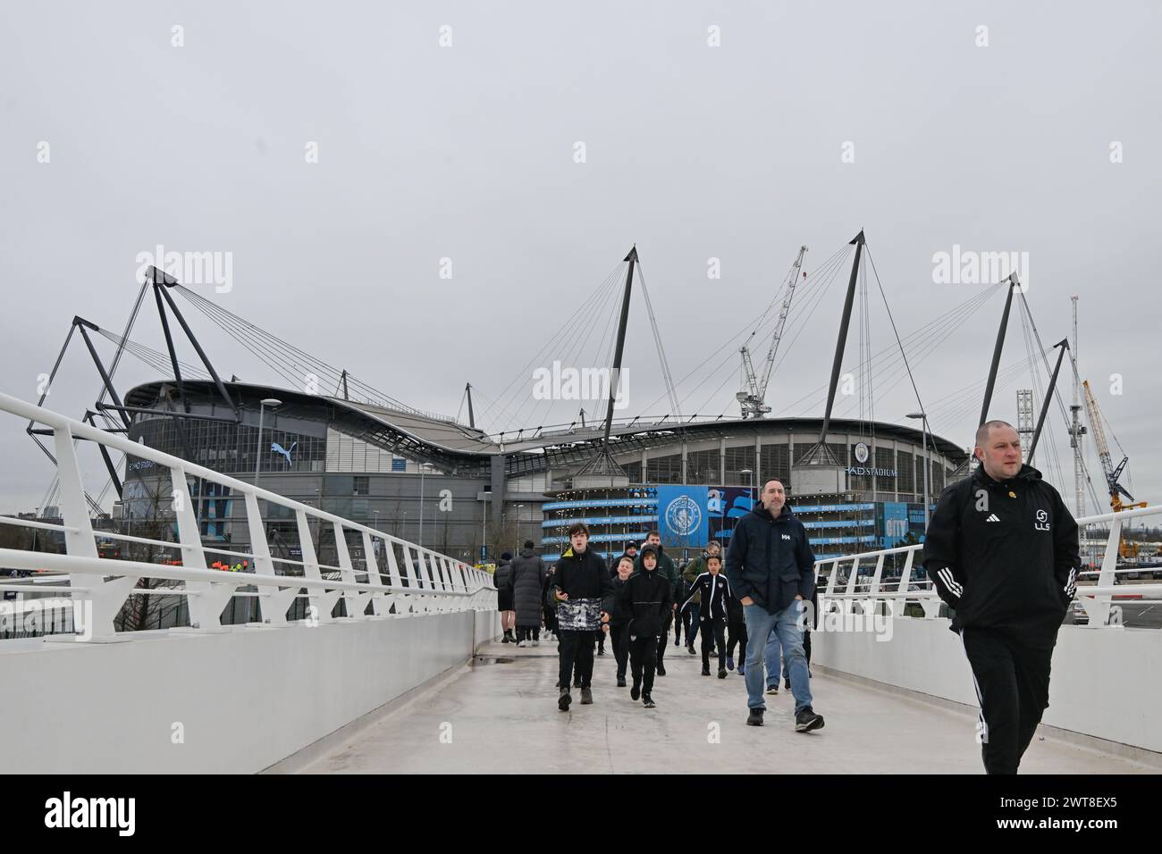 Fans arrive to the Etihad Stadium ahead of the Emirates FA Cup Quarter ...