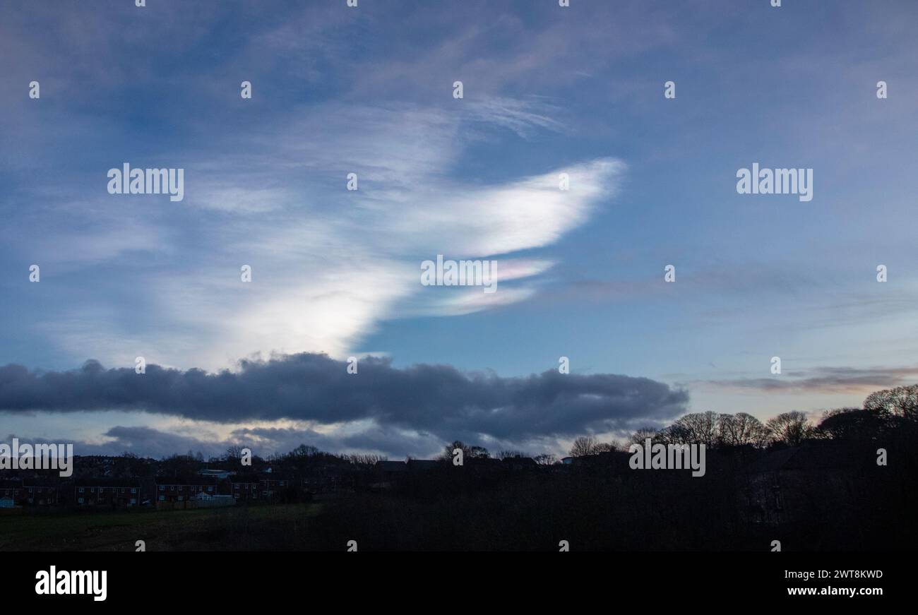 Nacreous clouds in blue sky Stock Photo