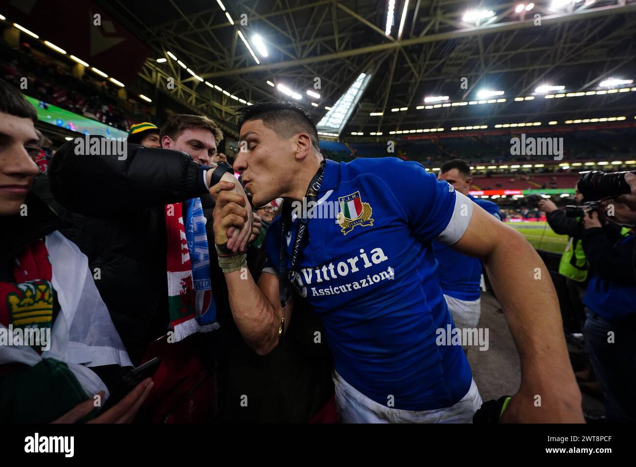 Man of the Match Ignacio Brex of Italy kisses a fan's hand after the Guinness Six Nations match at the Principality Stadium, Cardiff. Picture date: Saturday March 16, 2024. Stock Photo