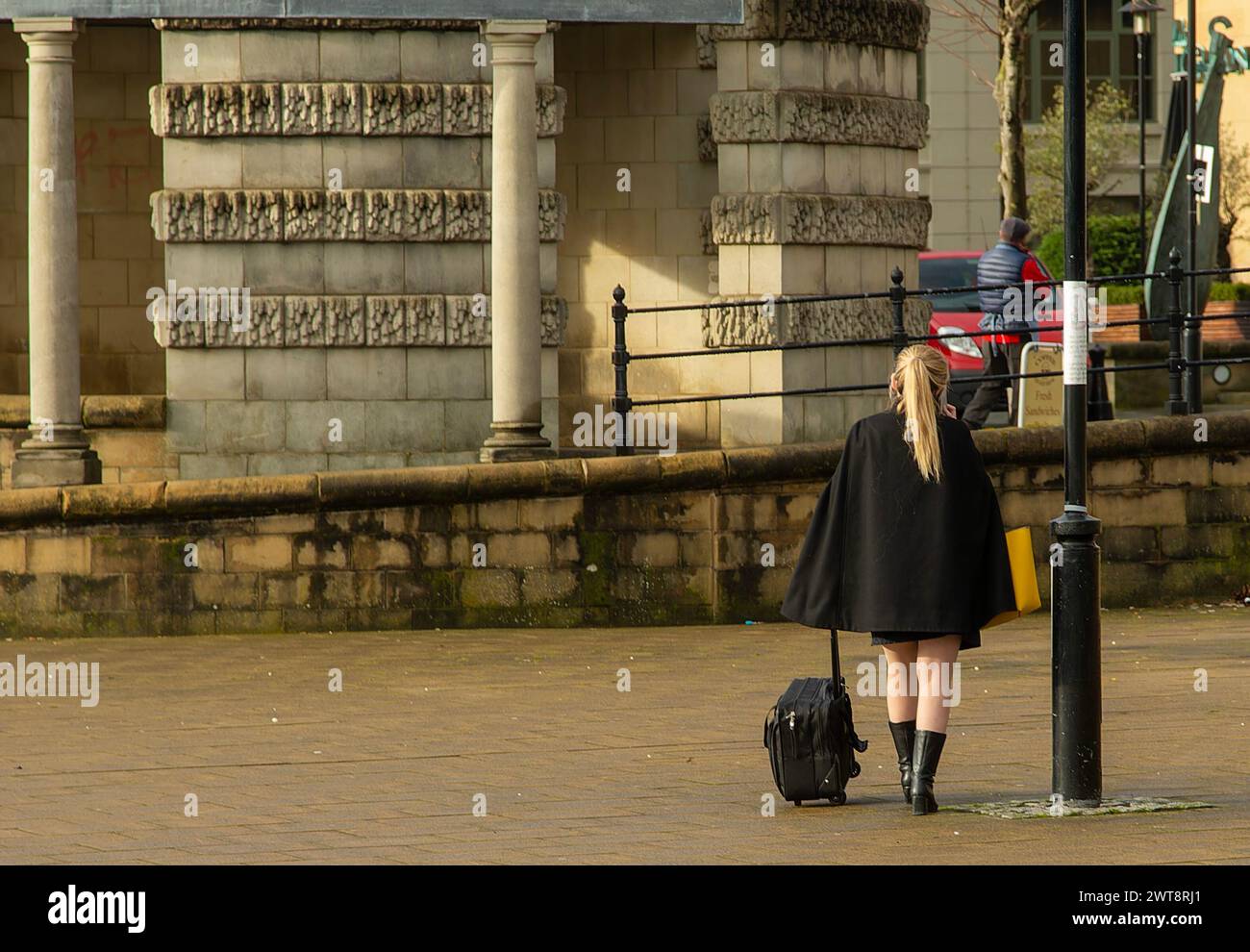 A lonely walk to her place of employment Stock Photo