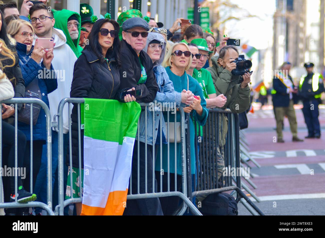 New York City, United States. 16th March, 2024. Group of people wearing green to represent Ireland wait for the annual St. Patrick’s Day Parade along Fifth Avenue in New York City. Credit: Ryan Rahman/Alamy Live News Stock Photo