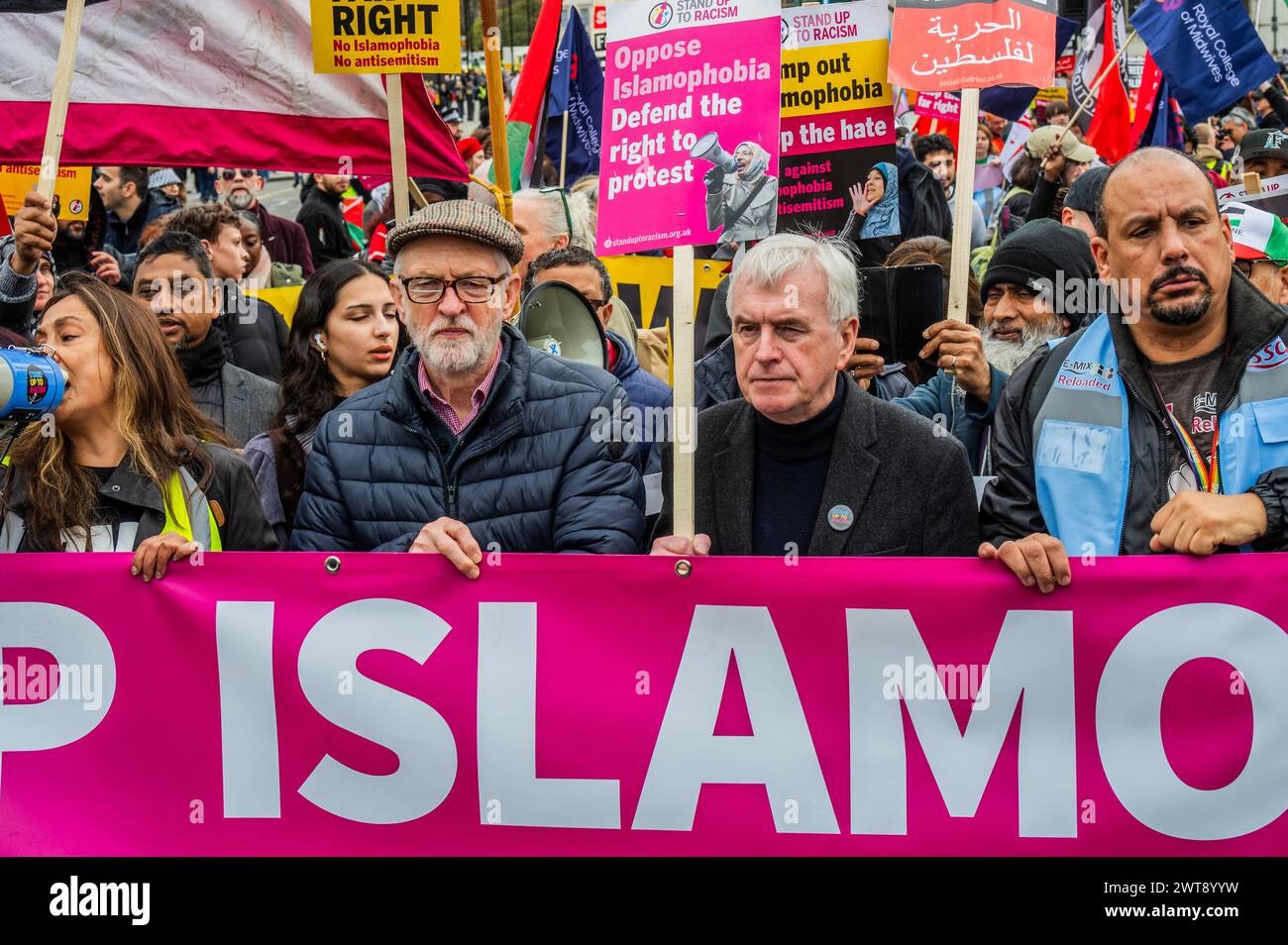 London, UK. 16th Mar, 2024. Jeremy Corbyn MP joins John McDonnell MP to lead the march Passing the Houses of Parliament - A Stop Racism, Stop the Hate demonstration in London. It was organised by Stand Up To Racism in conjunction with #HouseAgainstHate, @R3SoundSystem and @lmhrnational supported by 17 trade unions, The Muslim Council of Britain Jewish Socialists' Group other faith groups, organisations, campaigns and Trades Union Congress (TUC). Credit: Guy Bell/Alamy Live News Stock Photo