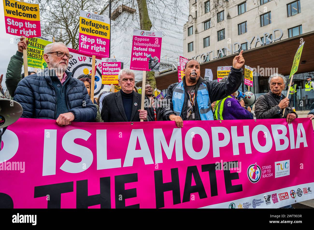London, UK. 16th Mar, 2024. Jeremy Corbyn MP joins John McDonnell MP to lead the march as it pauses at New Scotland Yard to remember Chris Kaba - A Stop Racism, Stop the Hate demonstration in London. It was organised by Stand Up To Racism. Credit: Guy Bell/Alamy Live News Stock Photo