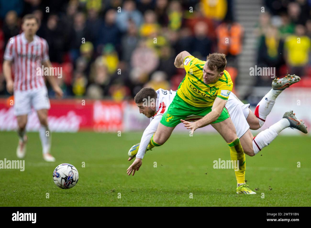 16th March 2024; Bet365 Stadium, Stoke, Staffordshire, England; EFL Championship Football, Stoke City versus Norwich City; Lynden Gooch of Stoke City is tackled by Jack Stacey of Norwich City Stock Photo