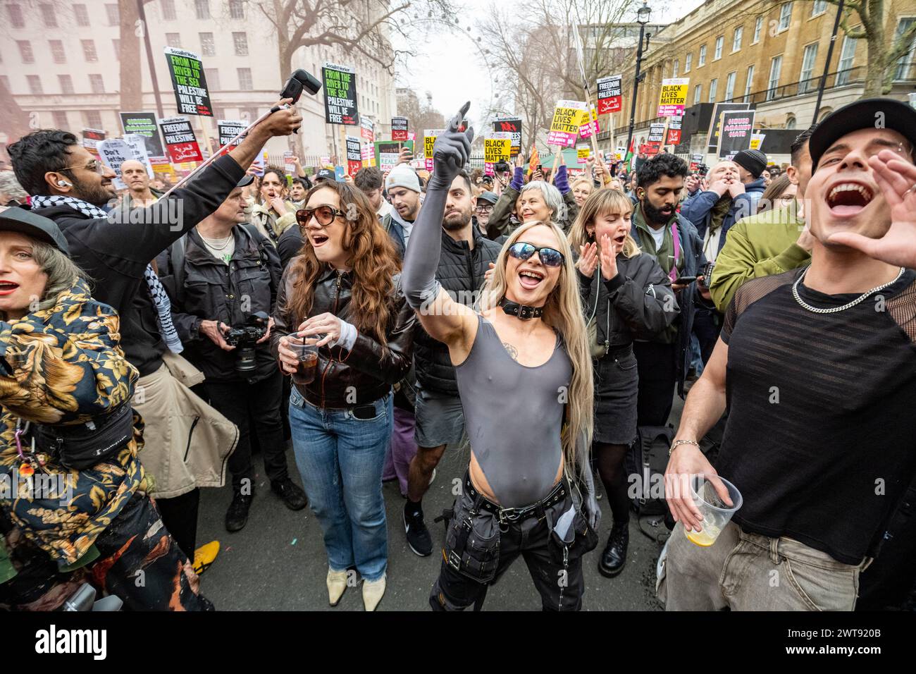 London, UK.  16 March 2024.  People dance outside Downing Street during a March Against Racism and House Against Hate event on UN Anti Racism Day.  Protesters march from the Home Office to Downing Street for a rally along with DJs and house music.  Credit: Stephen Chung / Alamy Live News Stock Photo