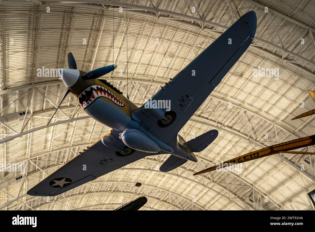 A Curtiss P-40B Warhawk Flying Tiger hangs from the ceiling at the Steven F. Udvar-Hazy Center at the National Air and Space Museum. Stock Photo