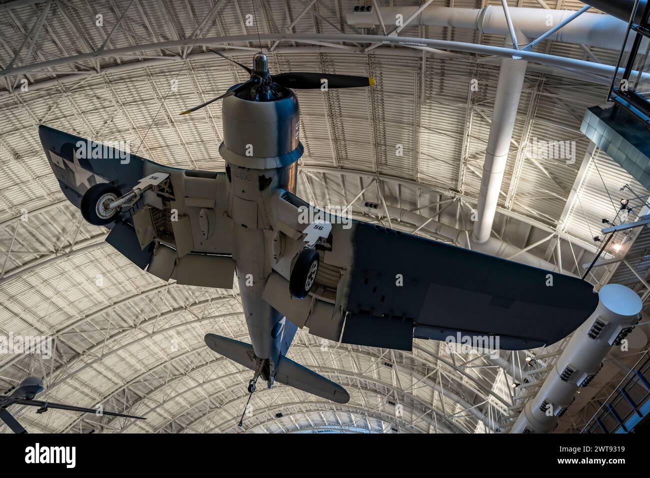 A vintage Vought F4U-1D Corsair fighter aircraft hangs from the ceiling at the Steven F. Udvar-Hazy Center, National Air and Space Museum. Stock Photo