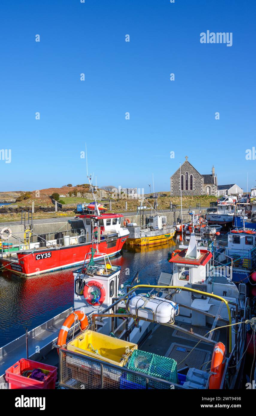Fishing boats in the harbour at Northbay, Isle of Barra, Outer Hebrides, Scotland, UK Stock Photo