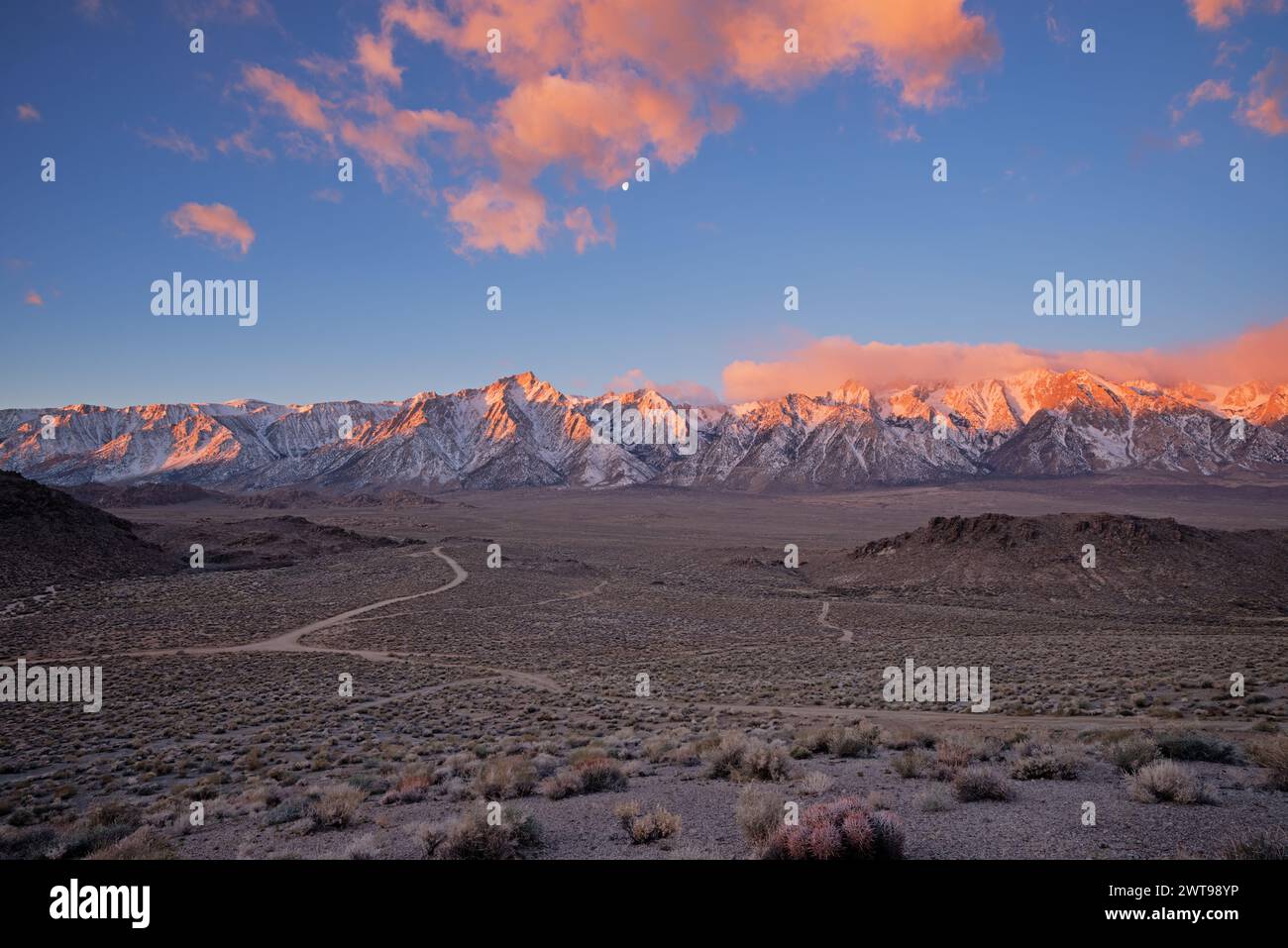 Hish Sierra sunrise from the Alabama Hills with Lone Pine Peak and clouds over the mountains Stock Photo