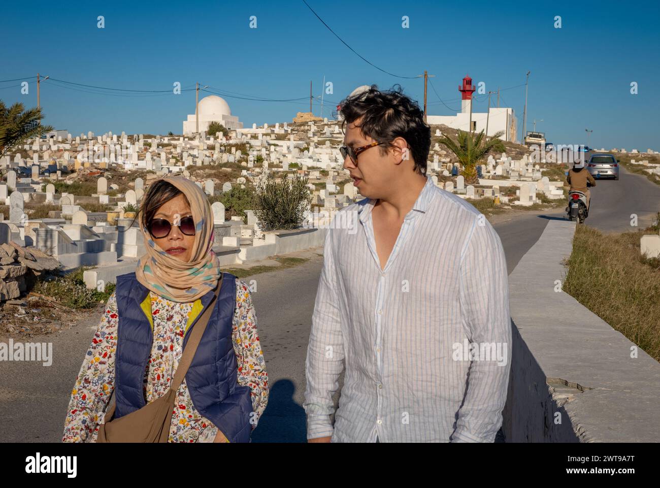Islamic Borg Foreign tourists walk past the Islamic Mahdia Maritime Cemetery and ...