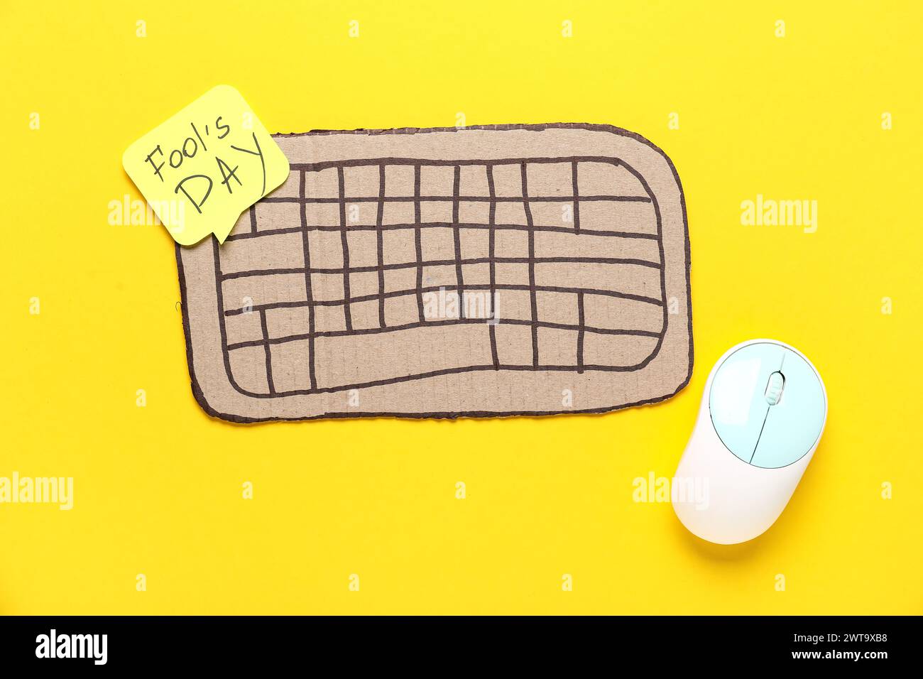 Carton computer keyboard, sticky note and mouse on yellow background