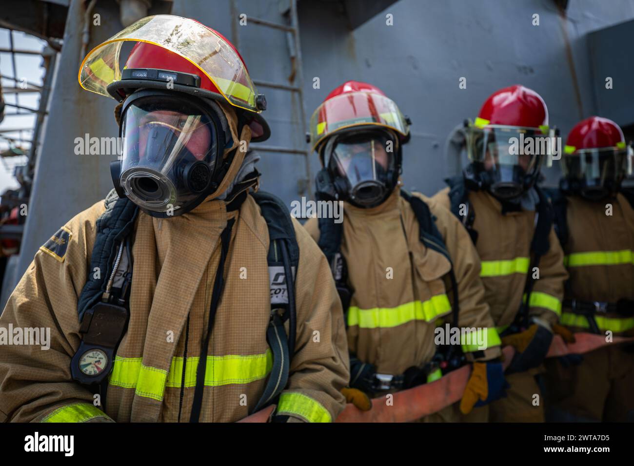 240308NDY4133050 GULF OF ADEN (March 8, 2024) Sailors man a hose