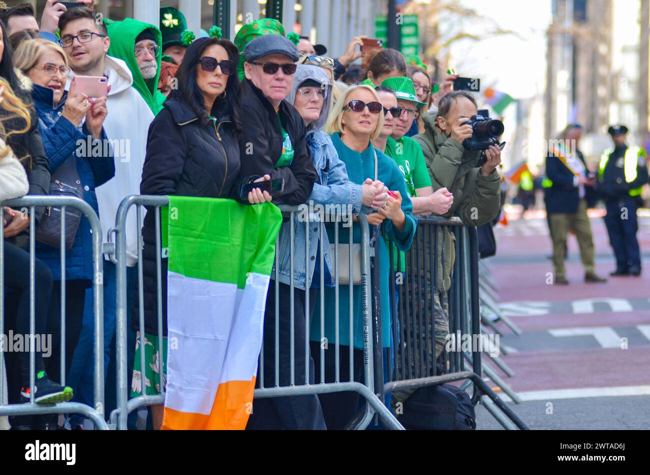 New York, New York, USA. 16th Mar, 2024. Group of people wearing green to represent Ireland wait for the annual St. Patrick's Day Parade along Fifth Avenue in New York City. (Credit Image: © Ryan Rahman/Pacific Press via ZUMA Press Wire) EDITORIAL USAGE ONLY! Not for Commercial USAGE! Stock Photo
