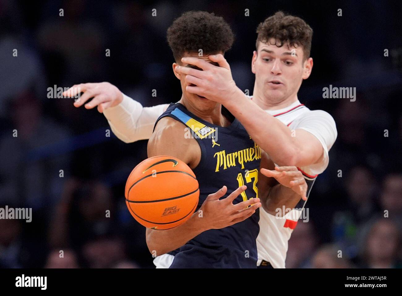Marquette forward Oso Ighodaro (13) fights for a loose ball against ...