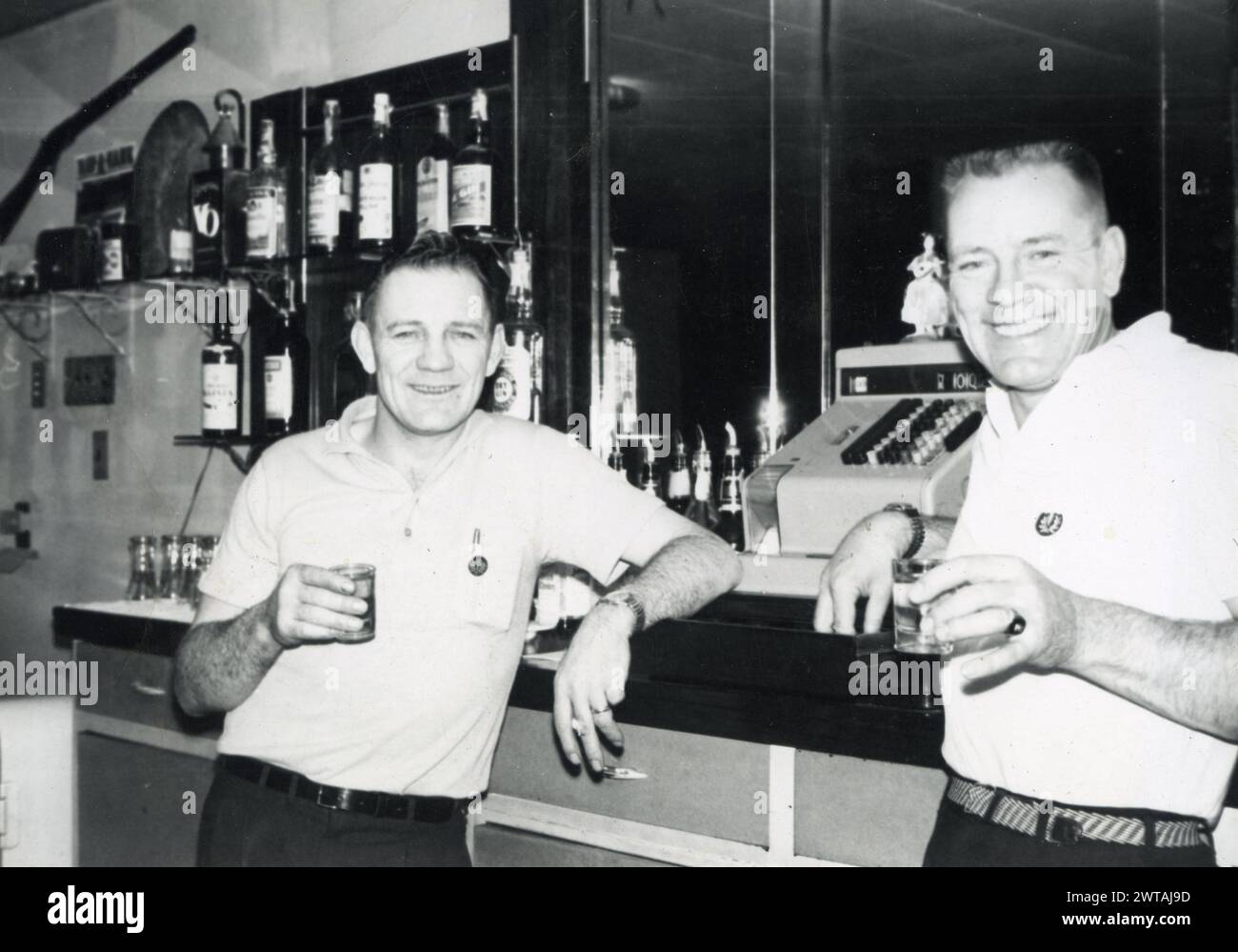 Two men drinking at Harvey’s Grove Tavern in 1962 Stock Photo