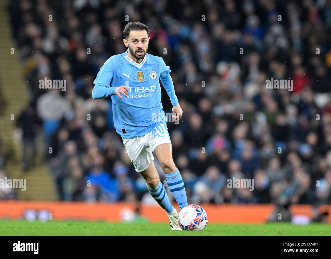 Bernardo Silva of Manchester City breaks forward with the ball, during
