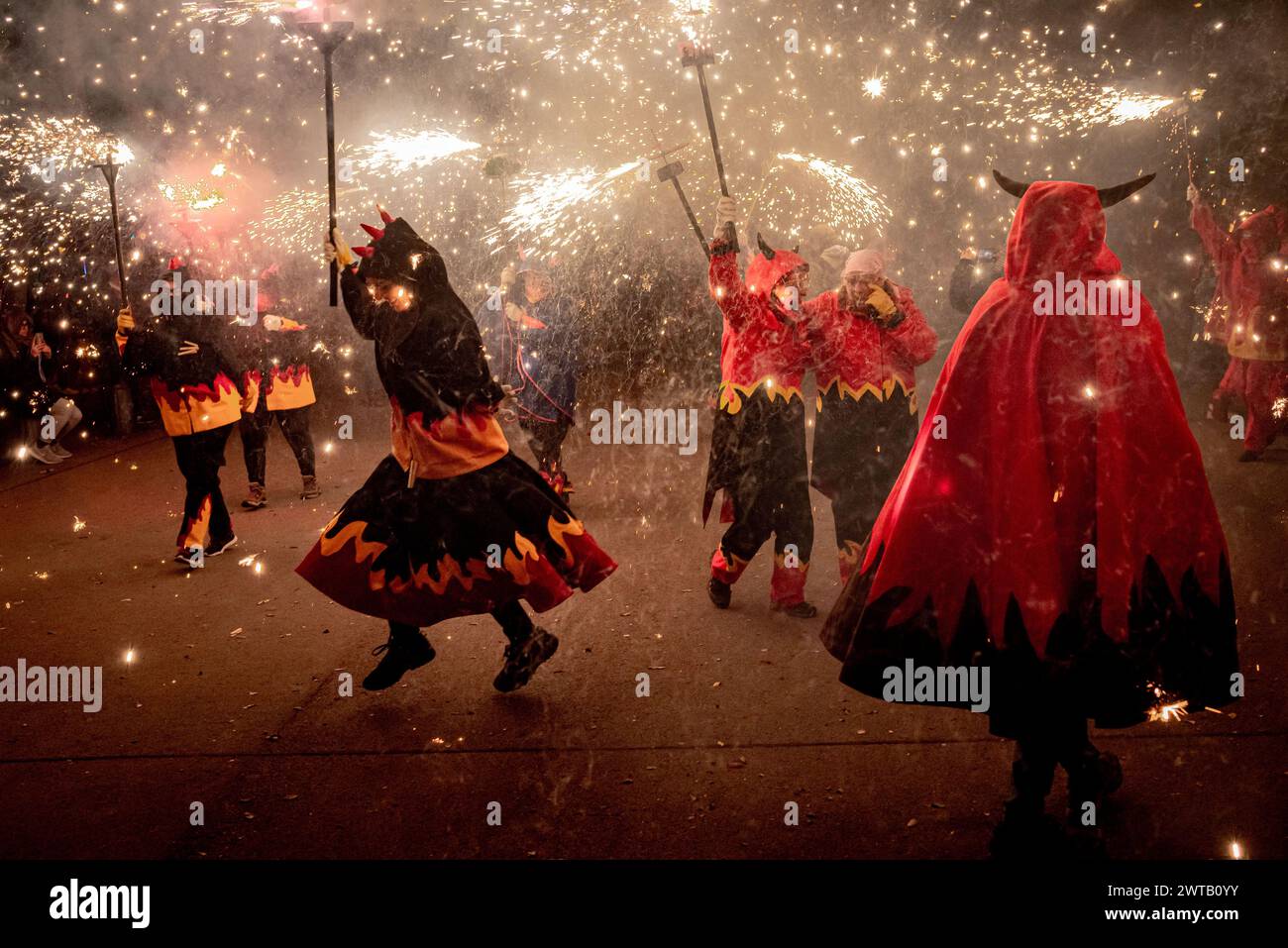 March 16, 2024, Barcelona, Spain. Women dressed as devils take part in ...