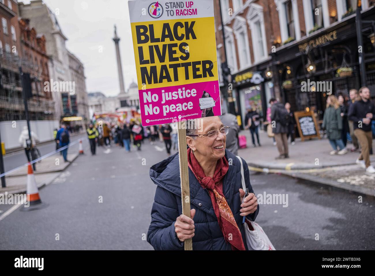 A protestor is seen holding a placard during the demonstration. Various ...