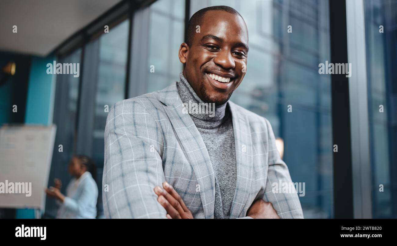Portrait of a professional man in business attire with a genuine smile, radiating happiness and contentment. His joyful expression captures the positi Stock Photo