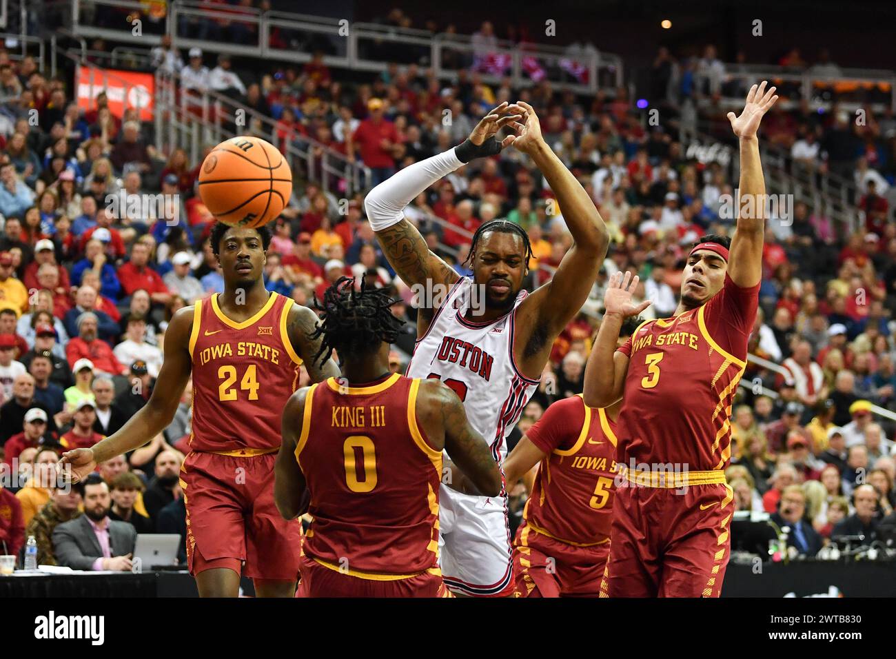 Kansas City, Missouri, USA. 16th Mar, 2024. Houston (12) C Jacob McFarland gets fouled by ISU (0) F Tre King on attempted layup.2024 Phillips 66 Big 12 Men's Basketball Championship game. (Credit Image: © James Leyva/ZUMA Press Wire) EDITORIAL USAGE ONLY! Not for Commercial USAGE! Stock Photo