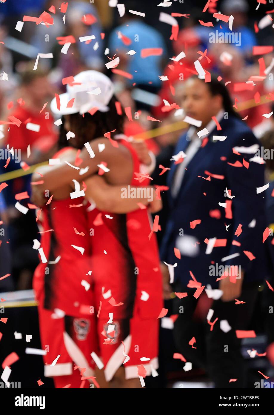 March 16, 2024: Two NC State teammates hug as the confetti flys after the championship game of the ACC Men's Basketball Tournament between the University of North Carolina Tarheels and the NC State Wolfpack at Capital One Arena in Washington, DC Justin Cooper/CSM Stock Photo