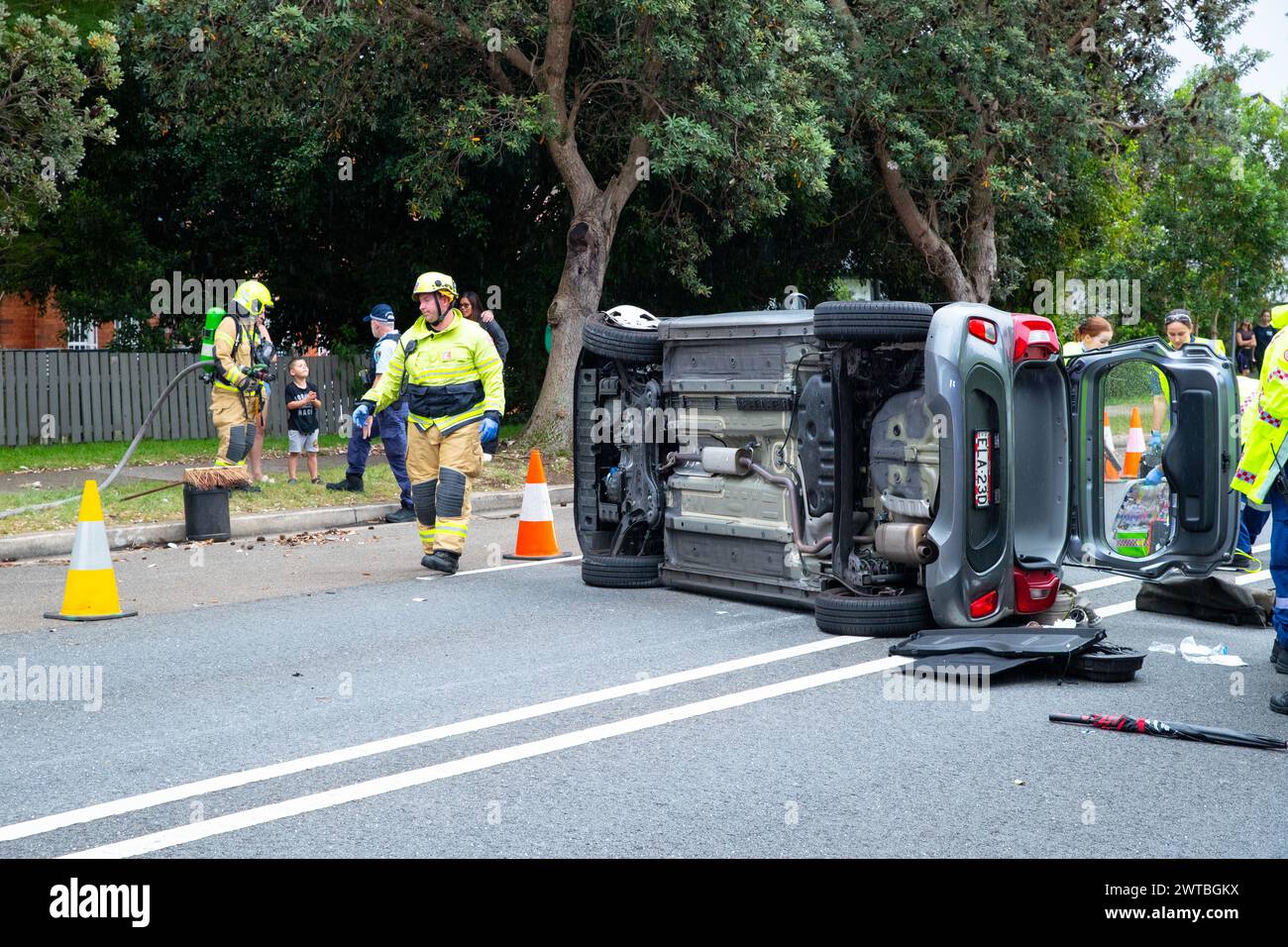 Sydney, Australia. 17 Mar 2024. A dramatic single vehicle accident has occurred on Carrington Road in Waverley in Sydney's Eastern Suburbs after an elderly female driver's car connected with a sloped abutment that sent her car toppling on its side. She was transported to hospital by ambulance workers. The abutment was part of a construction site that has been tasked with the de-construction of Waverley Communication Tower. Stock Photo