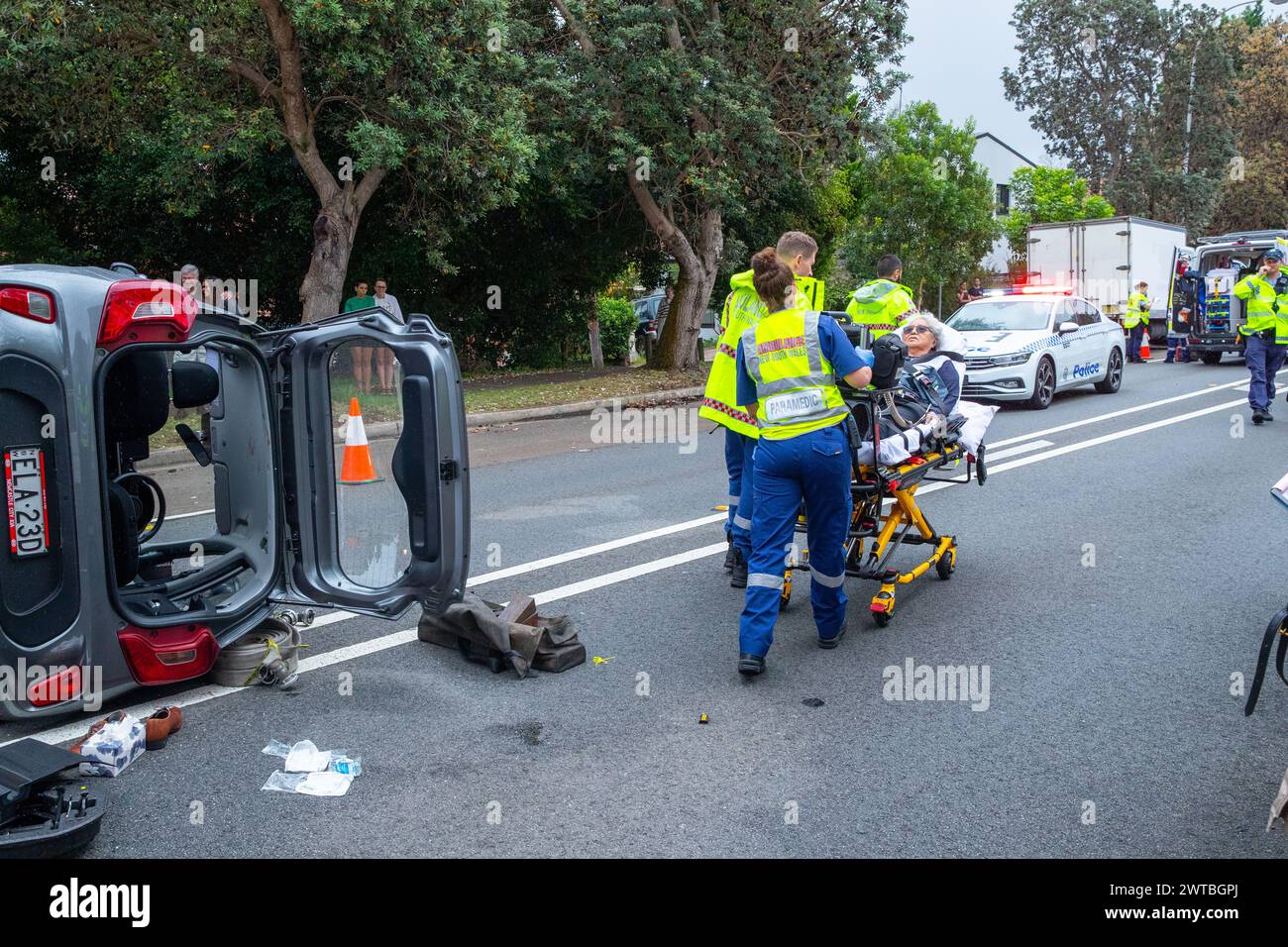 Sydney, Australia. 17 Mar 2024. A dramatic single vehicle accident has occurred on Carrington Road in Waverley in Sydney's Eastern Suburbs after an elderly female driver's car connected with a sloped abutment that sent her car toppling on its side. She was transported to hospital by ambulance workers. The abutment was part of a construction site that has been tasked with the de-construction of Waverley Communication Tower. Stock Photo