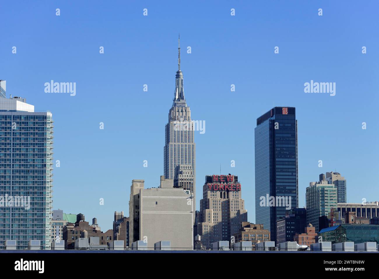 View of the Empire State Building surrounded by other skyscrapers, on the East River, Manhattan, Brooklyn, New York City, New York, USA, North America Stock Photo