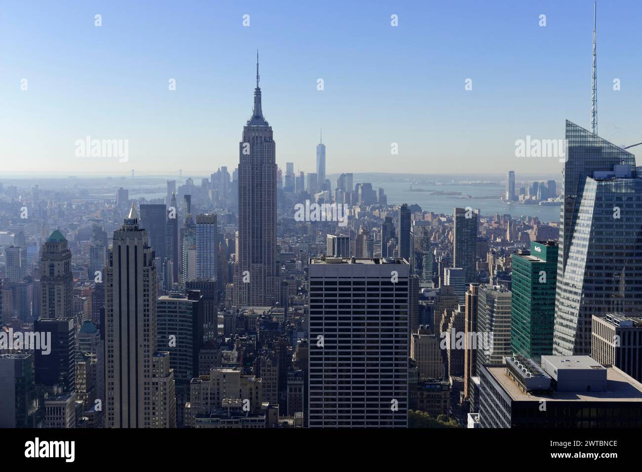 Viewing terrace of the Rockefeller Center, Empire State Building dominates the skyline under a cloudless blue sky, Manhattan, New York City, New Stock Photo