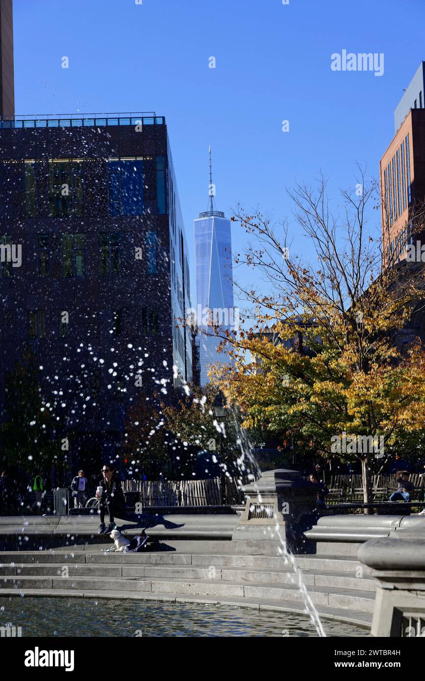 Water from a fountain with a background of autumn trees and a tall building, downtown Manhattan, Manhattan, New York City, USA, North America Stock Photo