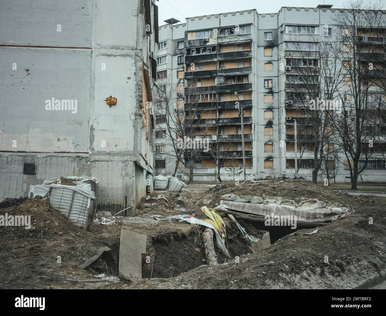 Trench and destroyed residential buildings, Severno Saltivka, Kharkiv, Ukraine Stock Photo