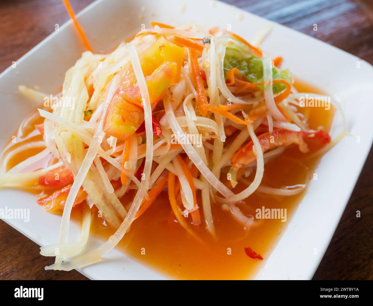 Thai papaya salad (Som tum Thai) on wood table Stock Photo - Alamy