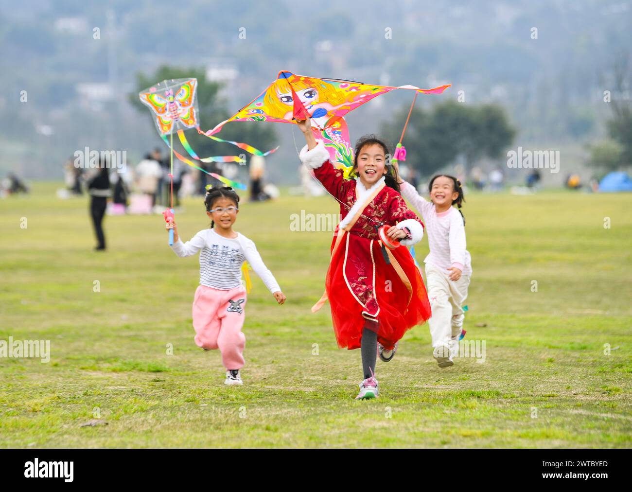 (240317) -- CHONGQING, March 17, 2024 (Xinhua) -- Children have fun at Guangyang Isle in southwest China's Chongqing, March 16, 2024. Guangyang Isle, the most extensive green island in the upper reaches of the Yangtze River, has been turned into an ecological restoration and protection 'classroom' for ecotourists and school children.The local ecosystem and biodiversity were once seriously threatened due to real-estate projects in the area. However, the local government brought harmful projects of this sort to a halt in 2017, starting the restoration of the environment on the island. (Xinhua/Wa Stock Photo