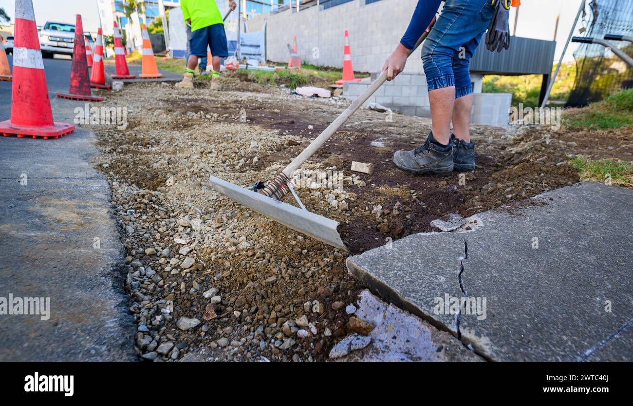 Road resurfacing. Workers repairing the road. Auckland. Stock Photo