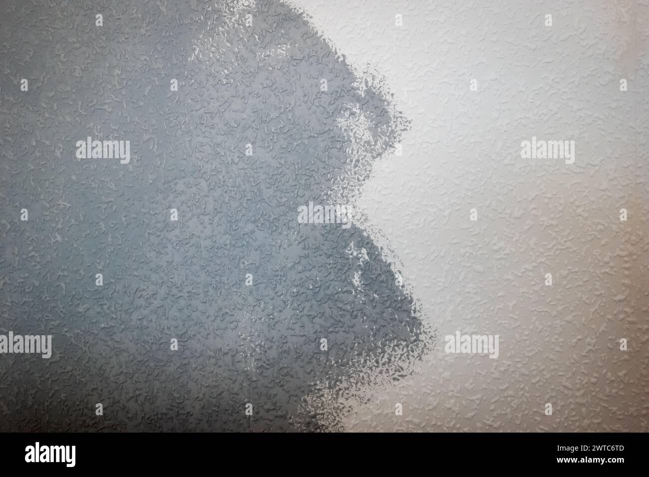 grey painted woodchip wallpaper texture pattern backgroung. Stock Photo