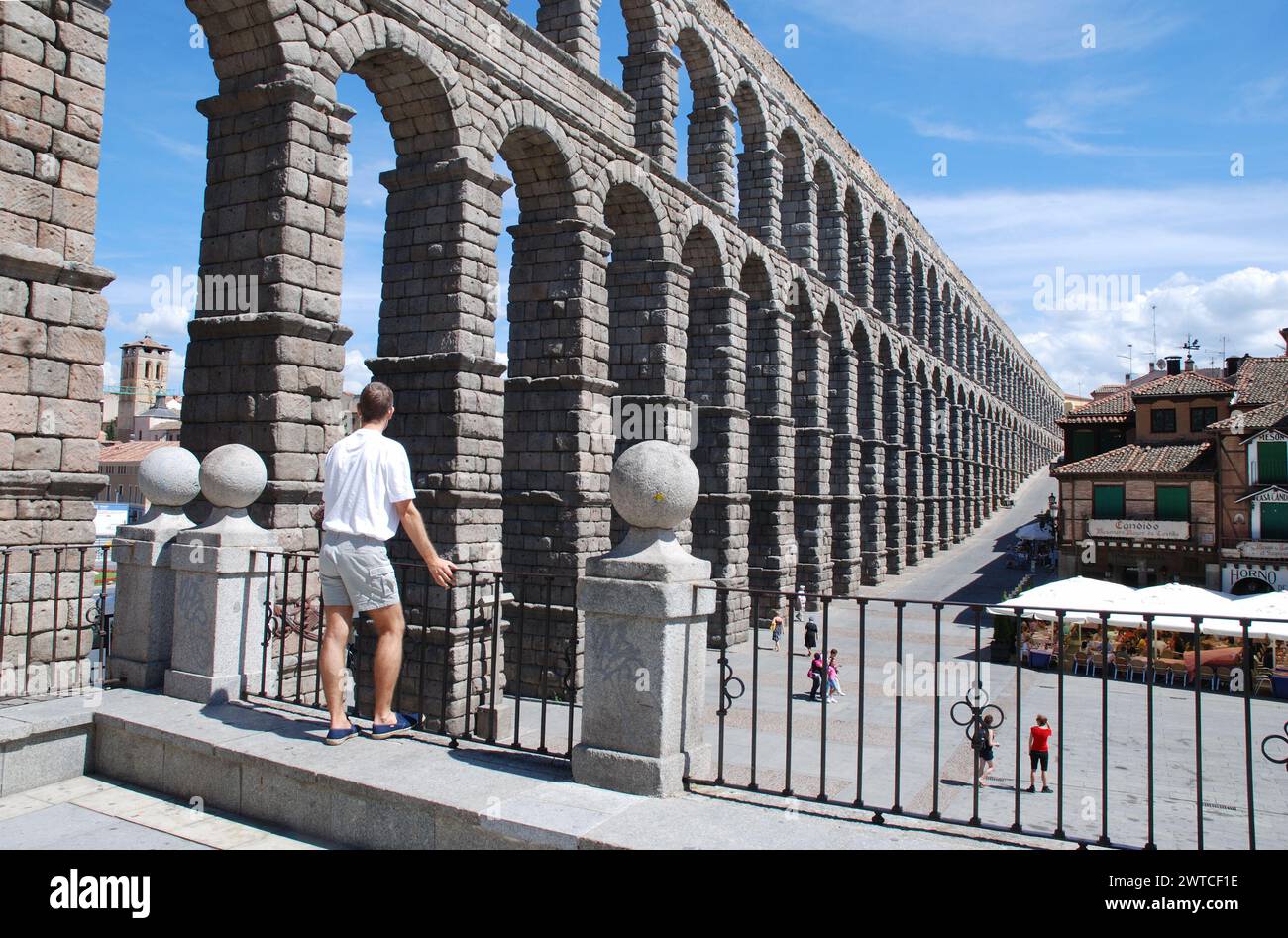 Man at the viewpoint over the Roman aqueduct. Segovia, Spain. Stock Photo
