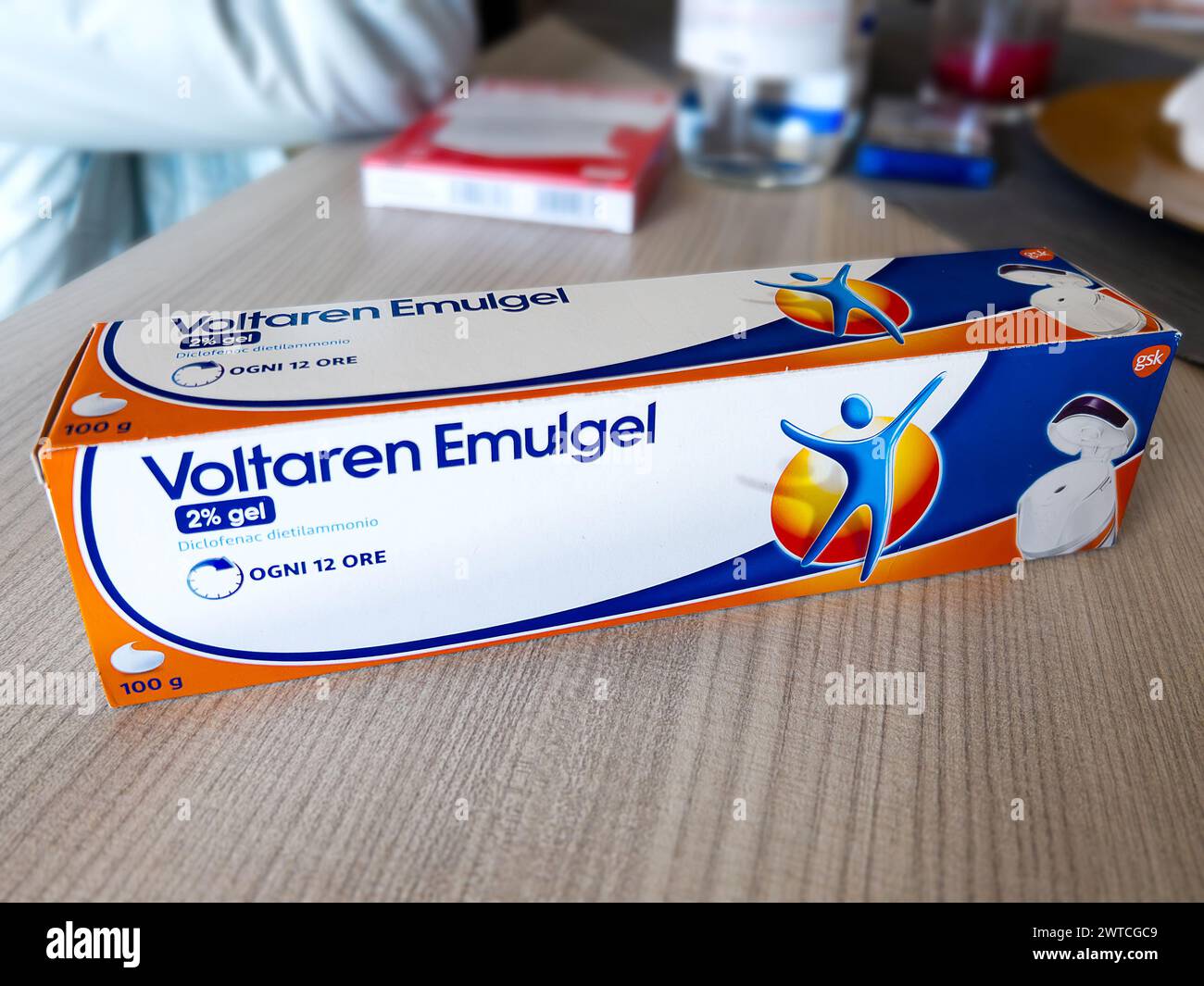 Turin, Italy - March 07, 2024: Voltaren Emulgel anti-inflammatory drug with active ingredient diclofenac sodium in package on wooden table Stock Photo