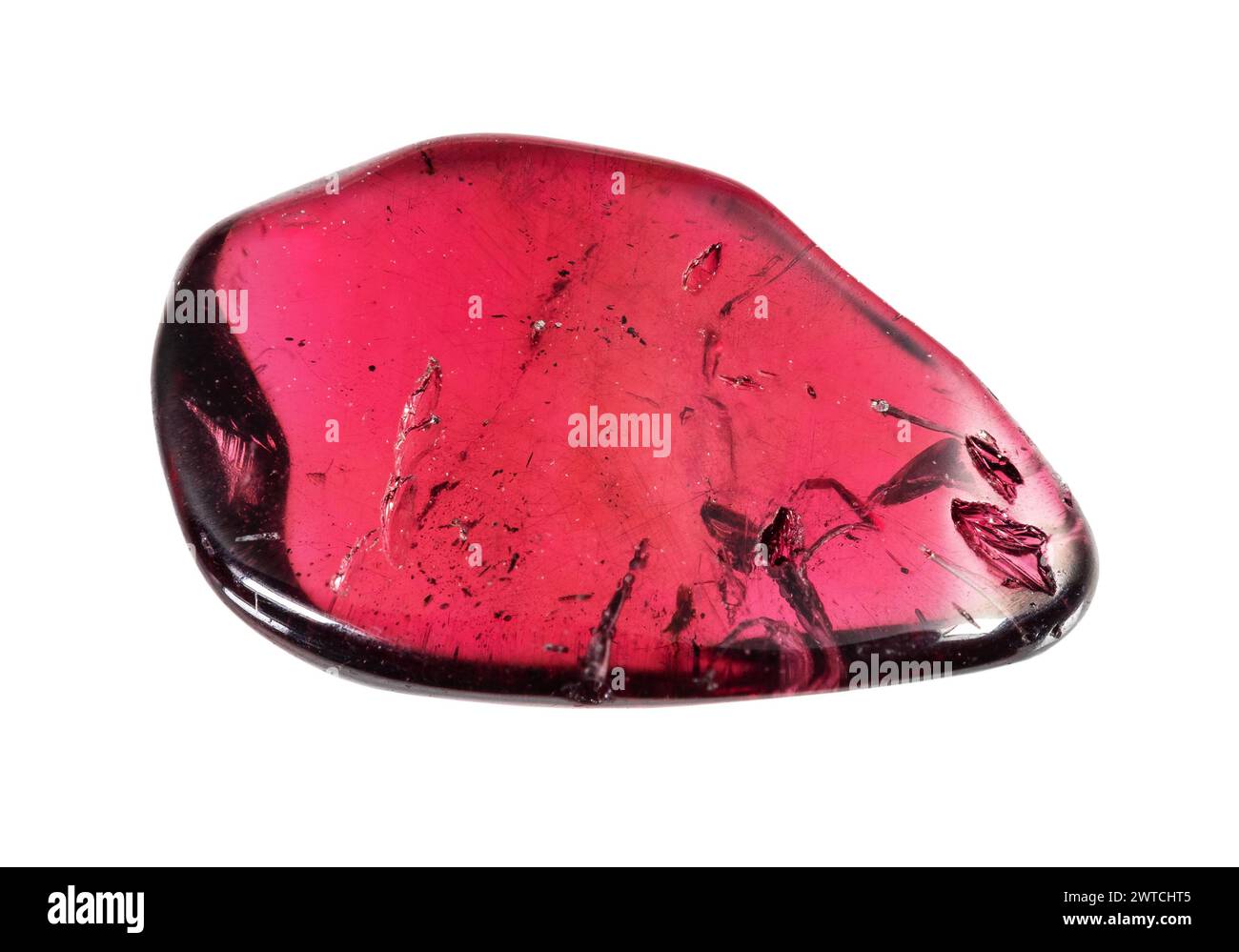 specimen of natural rolled pyrope crystal cutout on white background ...